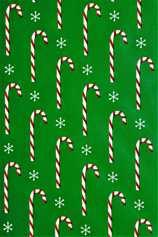 Candy Canes In Green Background Wallpaper