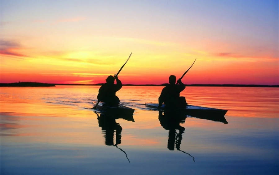 Canoeing In Sunset Wallpaper