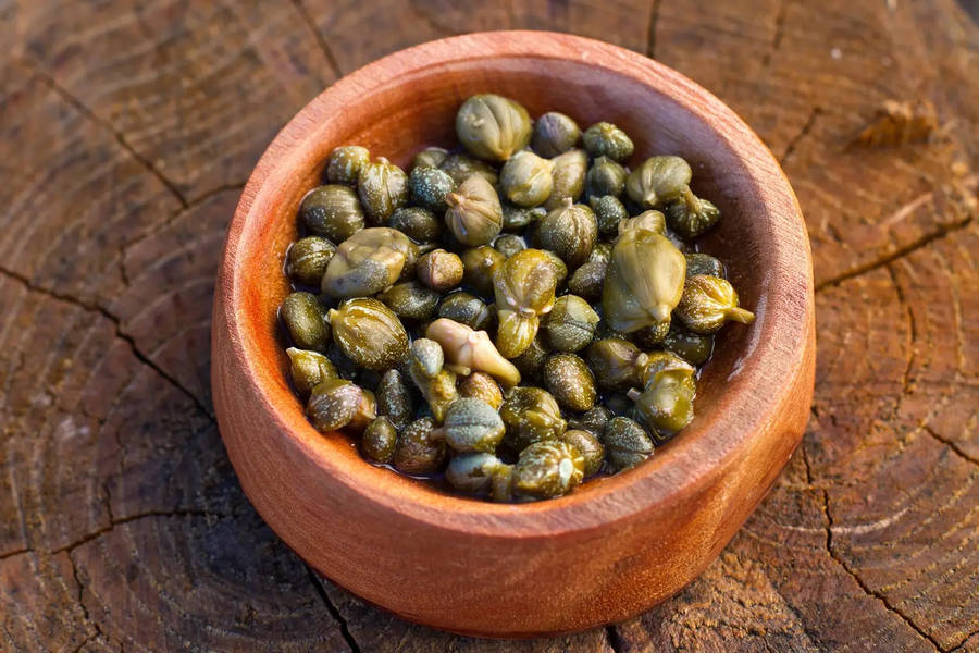 Capers In A Brown Clay Pot Wallpaper