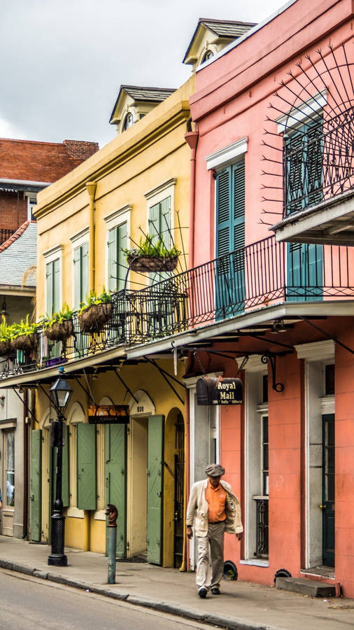 Caption: A Captivating Glimpse Of A Rustic Sidewalk In The Historic French Quarter. Wallpaper