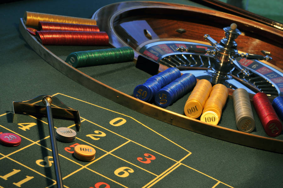 Caption: A Close-up View Of A Spinning Roulette Wheel Wallpaper