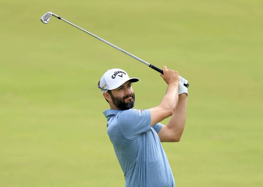 Caption: Adam Hadwin Powerfully Swinging For A Golf Shot Wallpaper