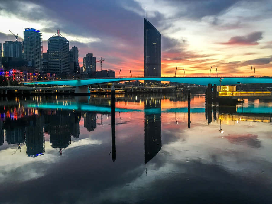 Caption: Astonishing Skyline Of Brisbane At Sunset Wallpaper