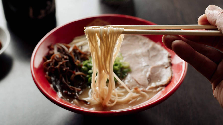 Caption: Authentic Hakata Ramen Served Hot With Chopsticks Wallpaper