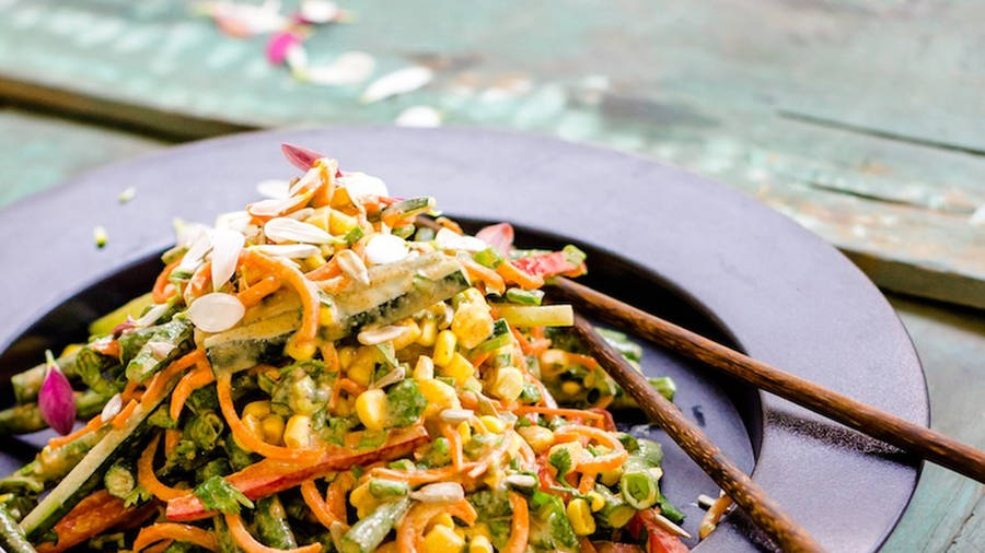 Caption: Authentic Pad Thai Stir-fry With Vibrant Vegetables. Wallpaper