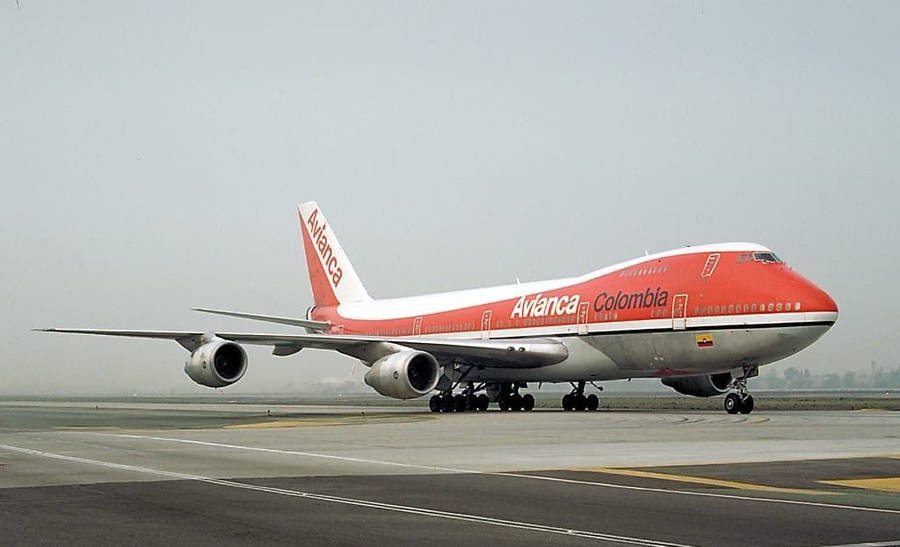 Caption: Avianca Airline Boeing 747 Cruising In The Azure Sky Wallpaper