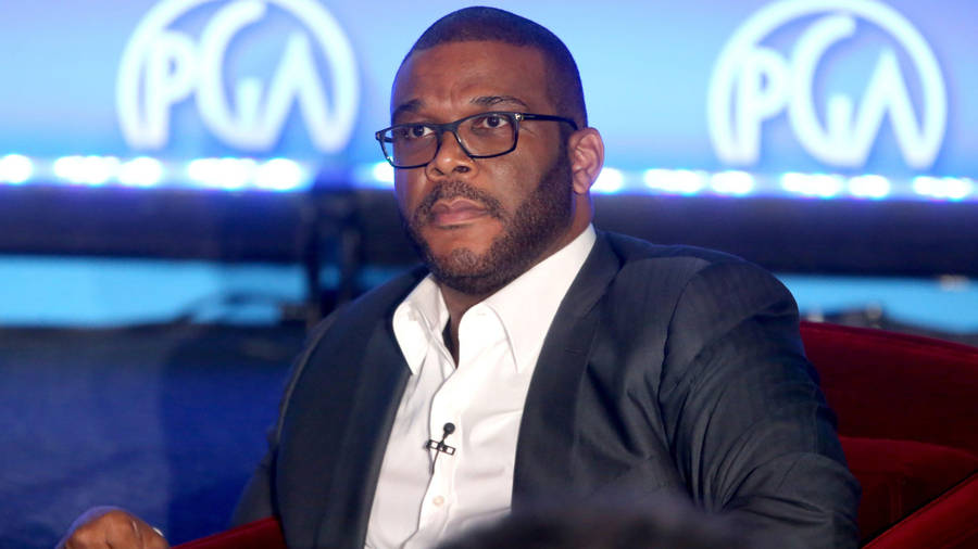 Caption: Award-winning Film Director Tyler Perry In A Classic Suit Wallpaper