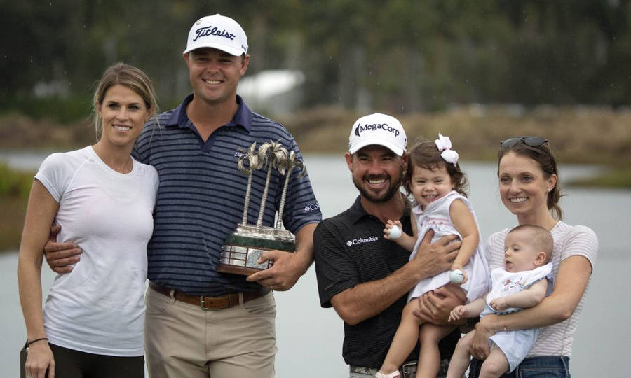 Caption: Brian Harman, Patton Kizzire And Their Families On A Golf Course. Wallpaper