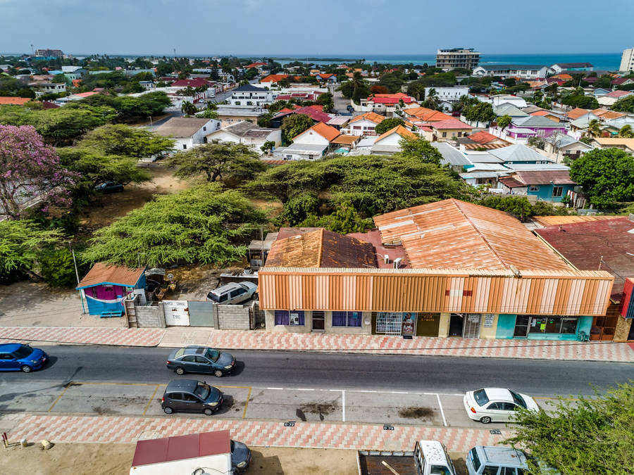 Caption: Bustling Life In A Residential Area, French Guiana Wallpaper