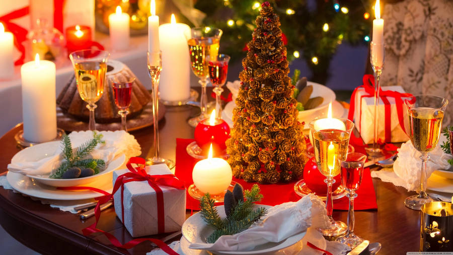 Caption: Captivating Candle-lit Christmas Dinner Wallpaper