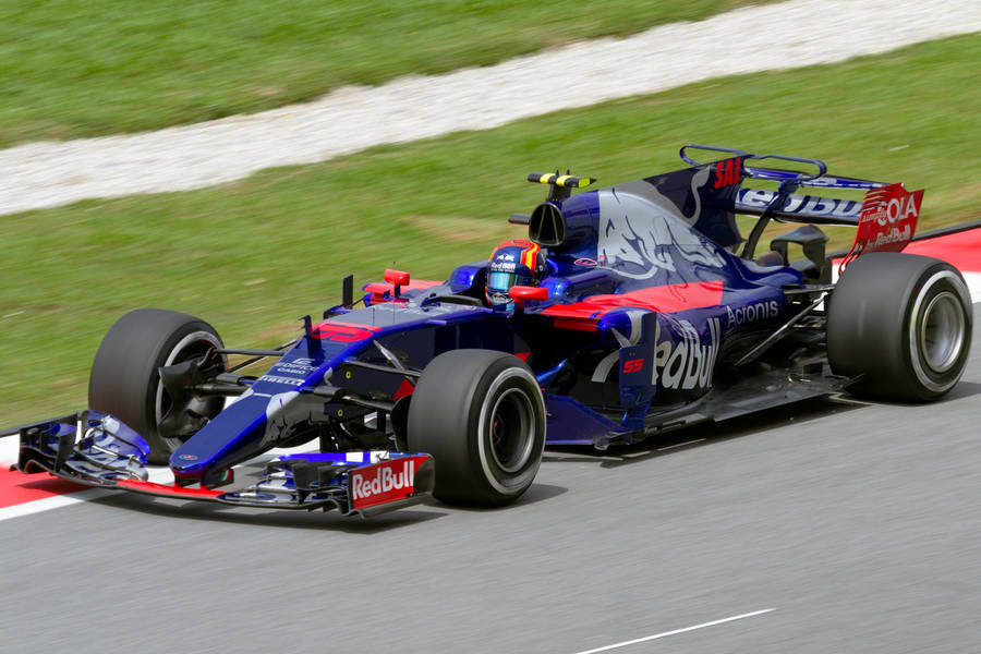 Caption: Carlos Sainz Jr Driving Toro Rosso Str12 Wallpaper