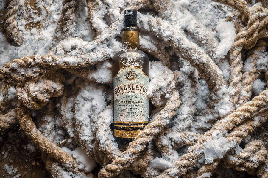 Caption: Chilled Shackleton Whisky In An Arctic Setting Wallpaper