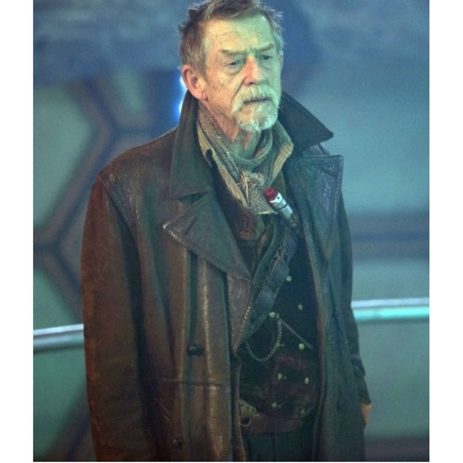 Caption: Classic John Hurt In Trench Coat Wallpaper