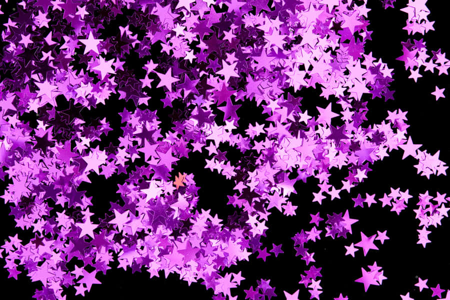 Caption: Dazzling Pink Stars In The Sky Wallpaper