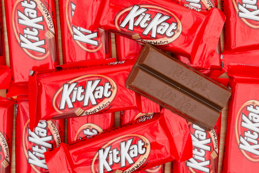 Caption: Delicious Stacks Of Kit Kat Chocolates Wallpaper