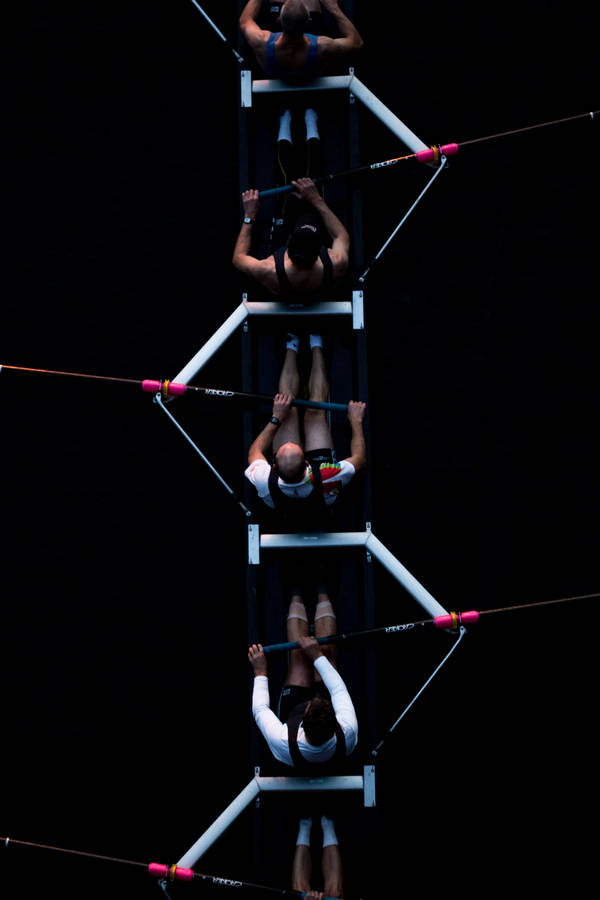 Caption: Determined Dragon Boat Racers In Action. Wallpaper