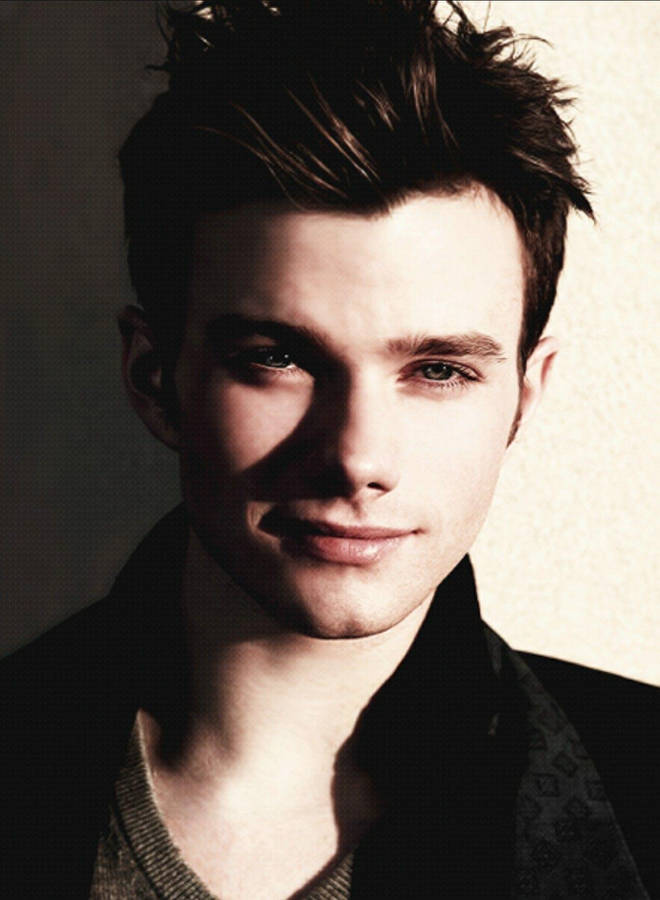 Caption: Elegant Chris Colfer Posing In A Handsome Photoshoot Wallpaper