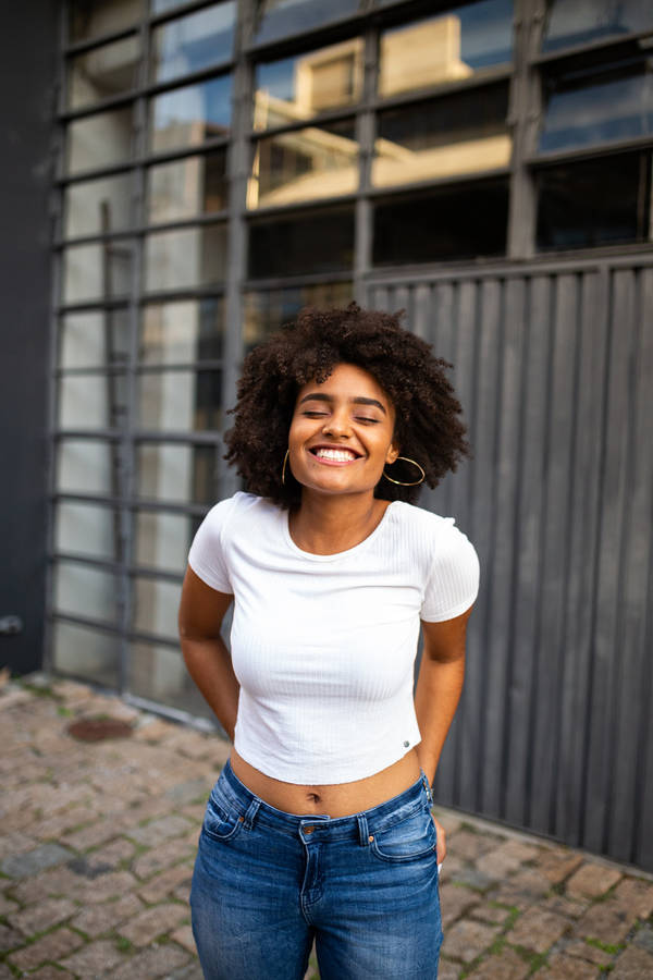 Caption: Empowered Elegance - A Black Woman In A Crisp White Shirt Wallpaper