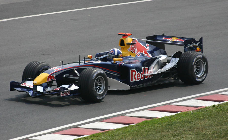 Caption: Exciting Turn Peak - Red Bull Racing With Coulthard Wallpaper