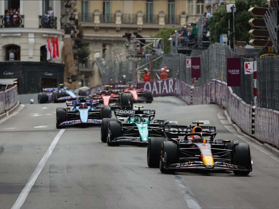 Caption: Formula 1 Race - High Adrenaline Action Wallpaper