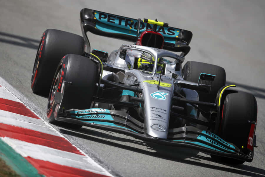 Caption: Formula 1 Racer At High Speed Wallpaper