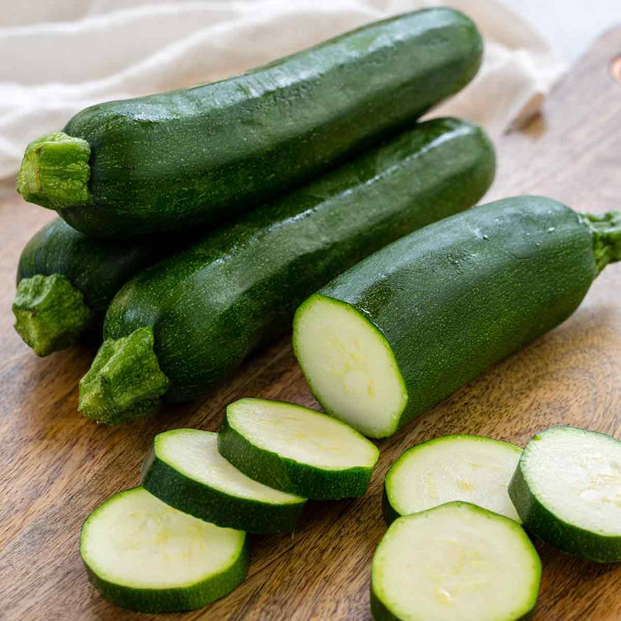 Caption: Fresh Zucchini Slices Showcasing White Flesh Wallpaper