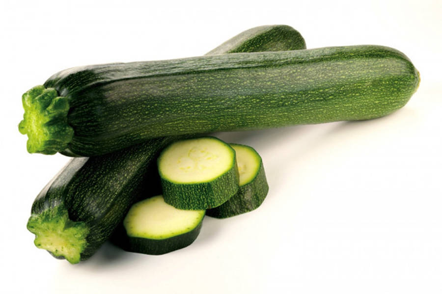 Caption: Fresh Zucchini With Sliced Pieces Close-up Wallpaper