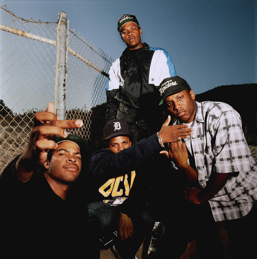 Caption: Iconic N.w.a. Pose - Malibu Fence, 1989 Wallpaper