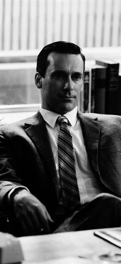 Caption: Jon Hamm Exhibiting Classic Men's Suit Style Wallpaper