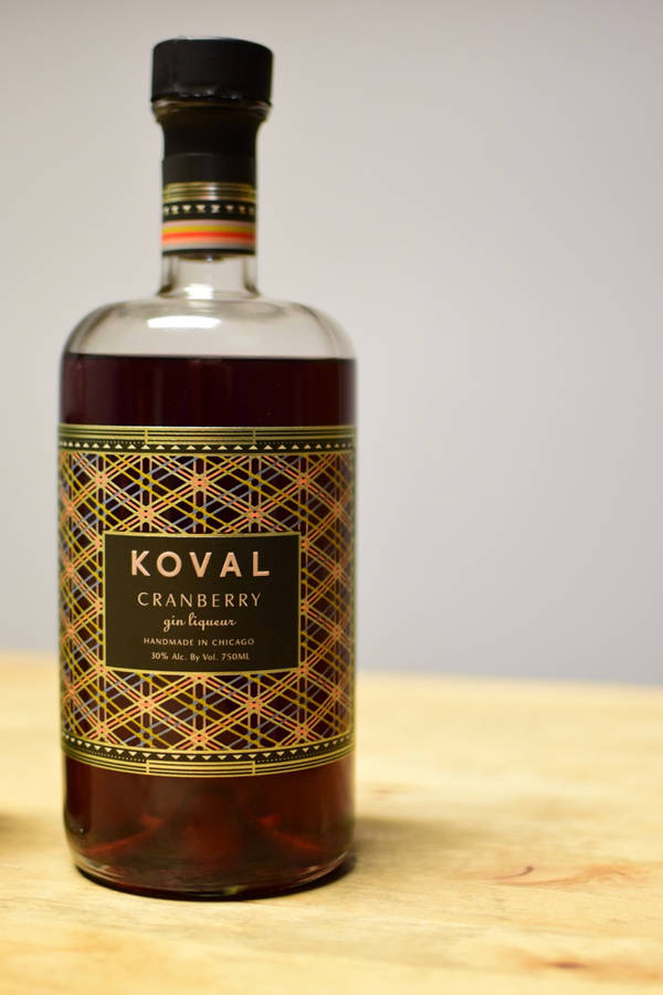 Caption: Koval Artisan Crafted Cranberry Gin Liqueur Wallpaper