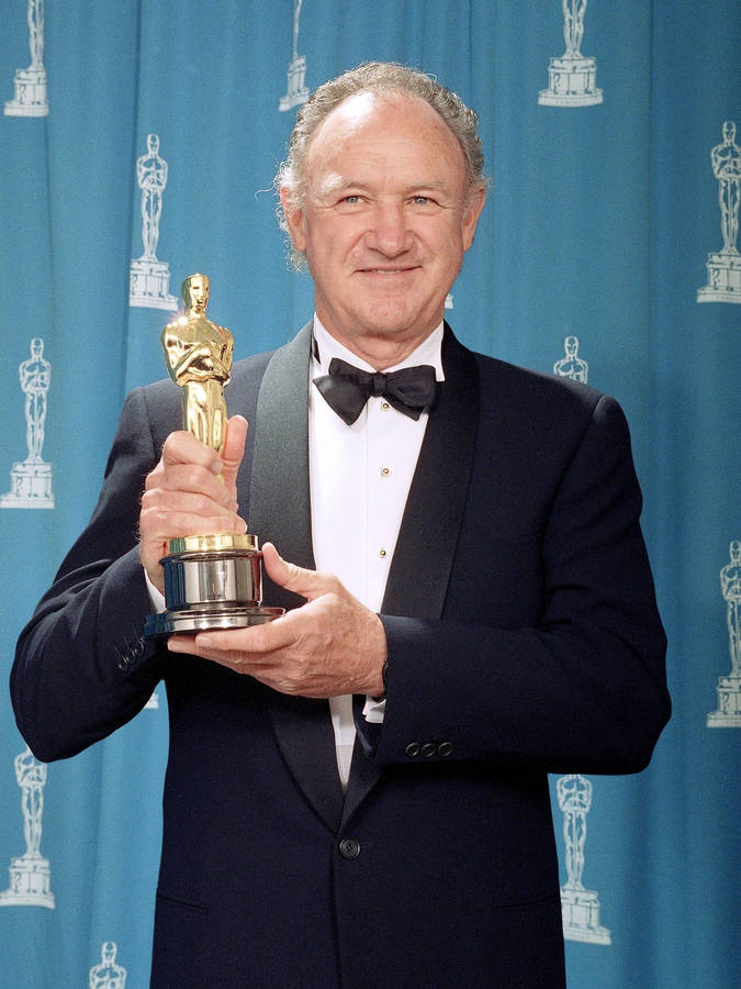 Caption: Legendary Actor Gene Hackman Celebrating With His Oscars Wallpaper