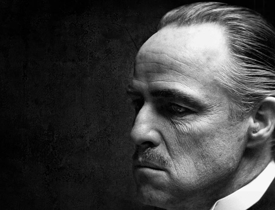 Caption: Legendary Actor Marlon Brando In The Godfather Trilogy Wallpaper