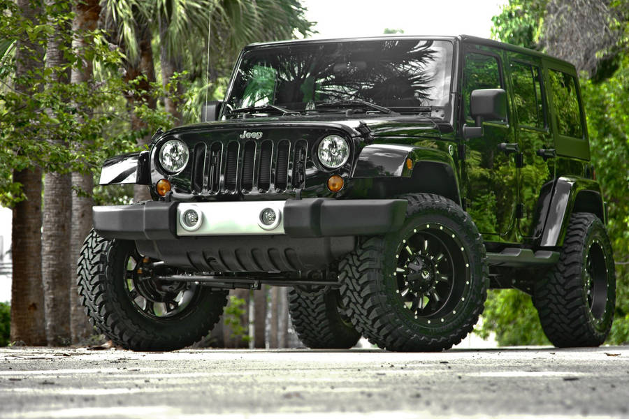 Caption: Majestic Black Jeep Wrangler On Display Wallpaper