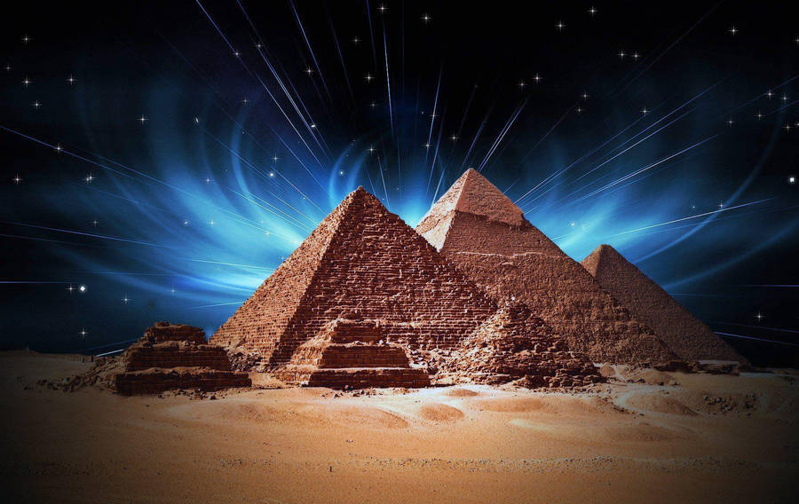 Caption: Majestic Illumination Of Cairo Pyramids At Night Wallpaper