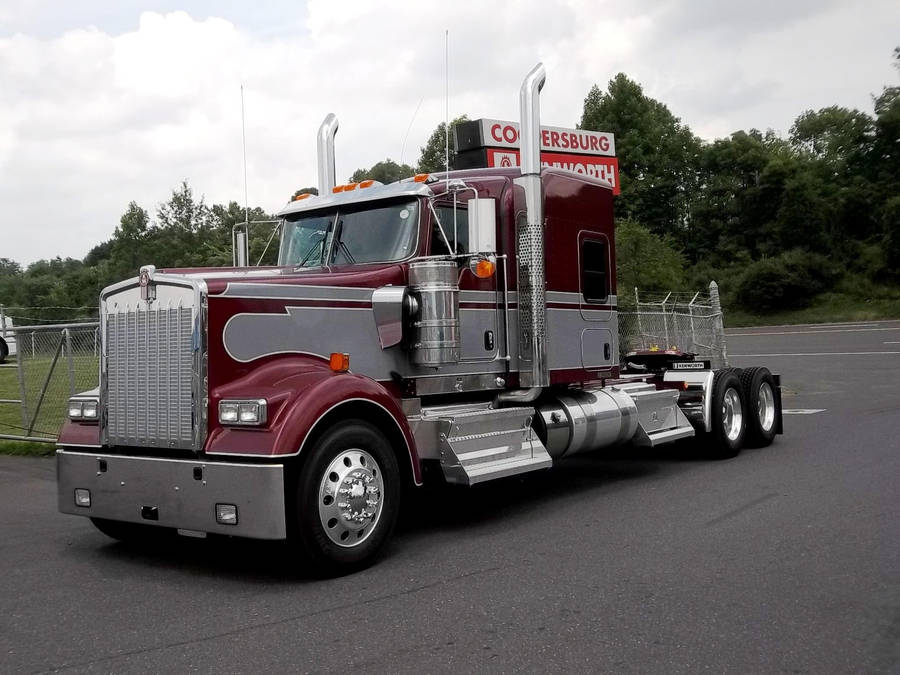 Caption: Majestic Maroon Kenworth W900 Semi-truck Wallpaper