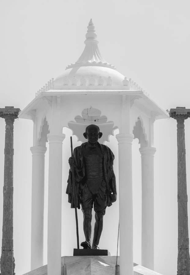 Caption: Majestic Statue Of Mahatma Gandhi Wallpaper