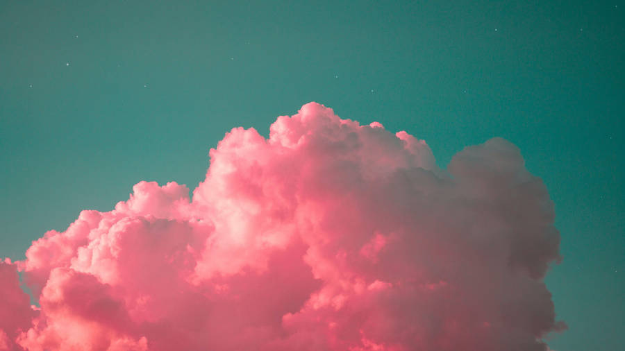 Caption: Mesmerizing Pink Cloud Enveloped In A Lush Teal Sky Wallpaper