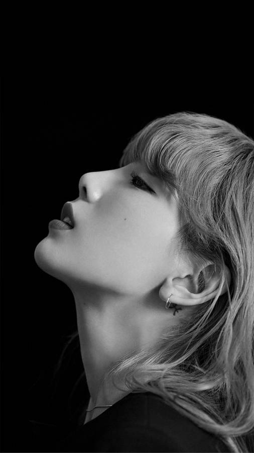 Caption: Mesmerizing Taeyeon Gazing Upwards In High Quality Photograph Wallpaper