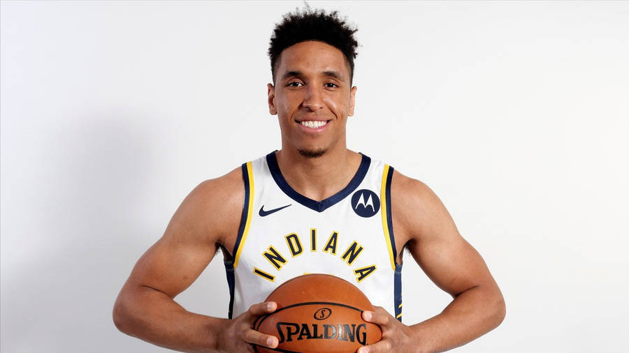 Caption: Nba Star Malcolm Brogdon In Action Wallpaper