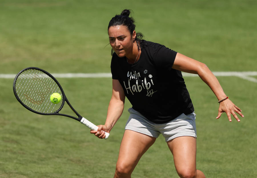 Caption: Ons Jabeur Proudly Displaying Her 'yalla Habibi' Sportswear T-shirt. Wallpaper