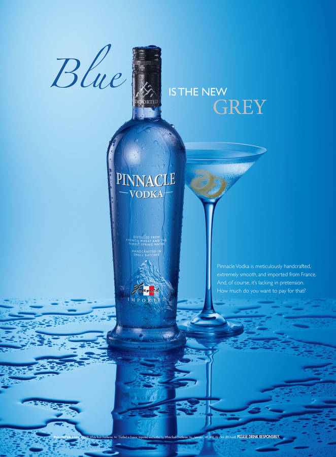 Caption: Pinnacle Vodka Blue Poster Immersed In Cool Ambiance Wallpaper