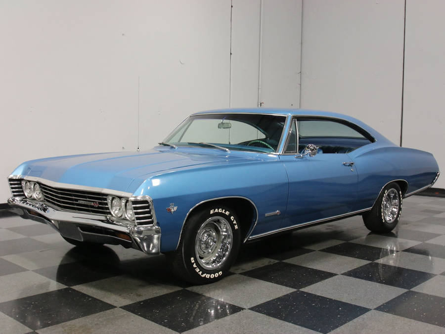 Caption: Pristine 1967 Chevrolet Impala In Marina Blue Wallpaper