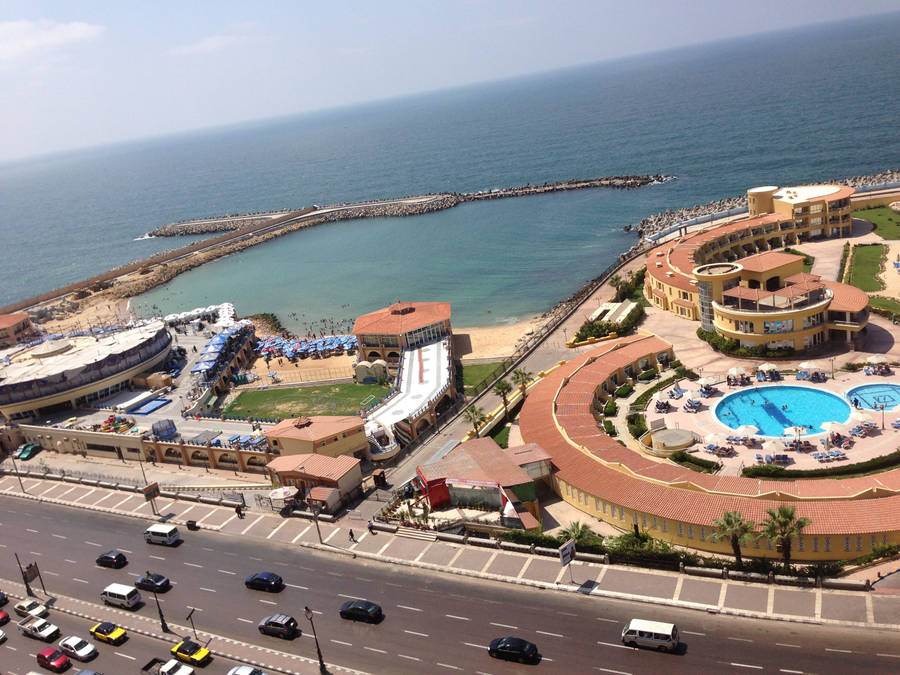 Caption: Pristine Alexandria Tolip Beach At Sunrise Wallpaper