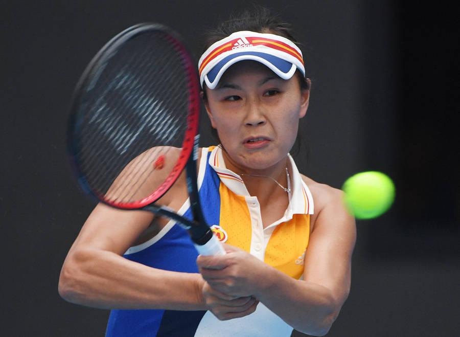 Caption: Shuai Peng In Action With Her Signature Double-hand Grip Wallpaper