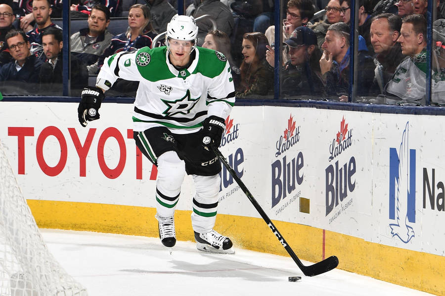 Caption: Skilled Dallas Stars Defenseman John Klingberg In Action Wallpaper