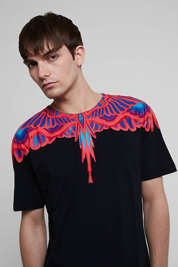 Caption: Striking Red Wings Design Black Shirt By Marcelo Burlon Wallpaper