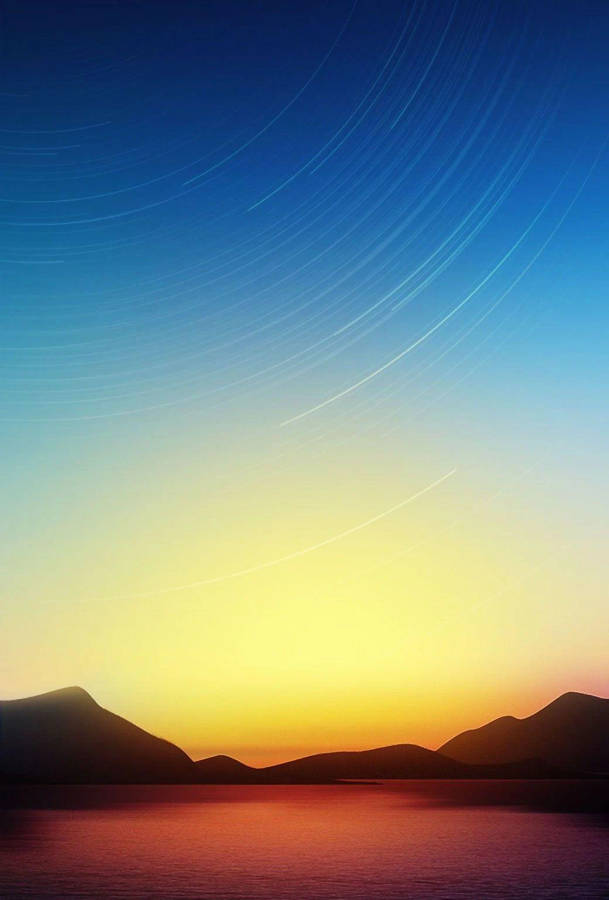 Caption: Stunning Miui Wallpaper Of Blue-yellow Sky Over A Desert Landscape Wallpaper