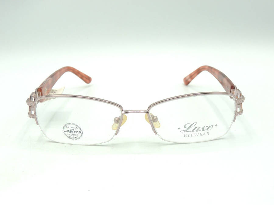 Caption: Stylish Unisex Luxe Eyeglass Embellished With Swarovski Elements Wallpaper