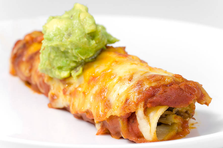 Caption: Tasty Enchilada Rolls Topped With Fresh Guacamole Wallpaper