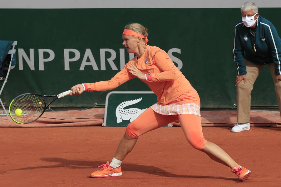 Caption: Tennis Ace Kiki Bertens In Peach Fila Outfit Wallpaper